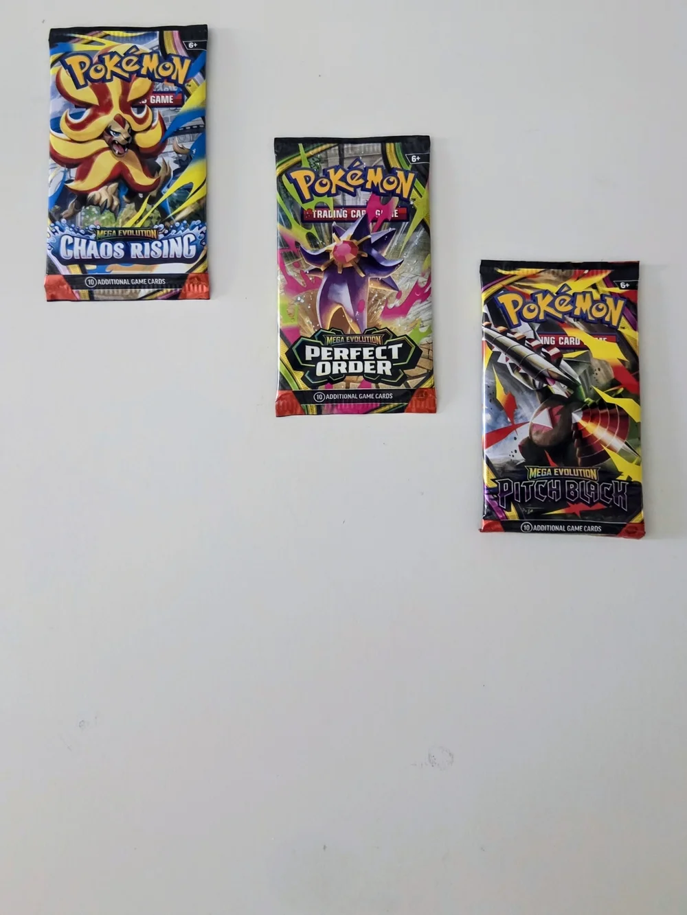 Pokémon Mega Evolution - Chaos Rising, Perfect Order & Pitch Black Booster Packs